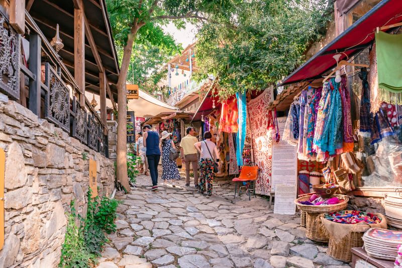 Tourists window shopping along the market place in Sirince Village.