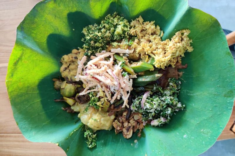 Sri Lankan vegan rice and curry on a lotus leaf
