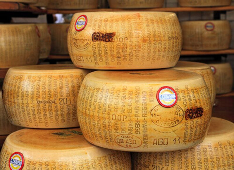 Wheels of Parmesan, a famous Italian hard cheese made from raw cow's milk in the town of Parma.