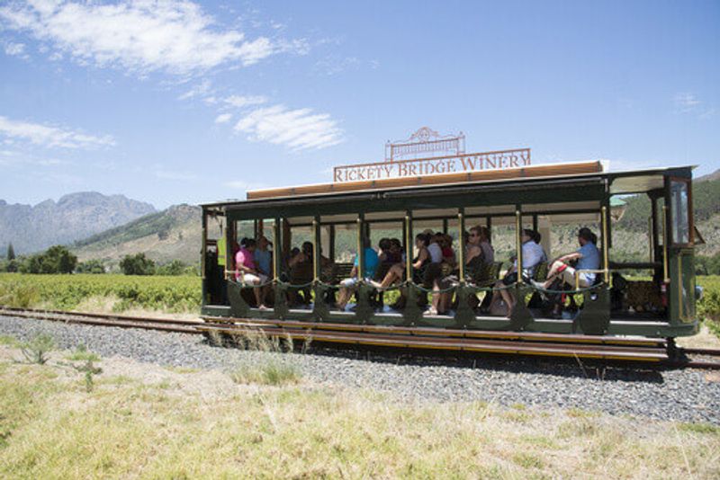 The Rickety Bridge Winery's tourist tram in the Franschhoek Valley of Western Cape, South Africa.