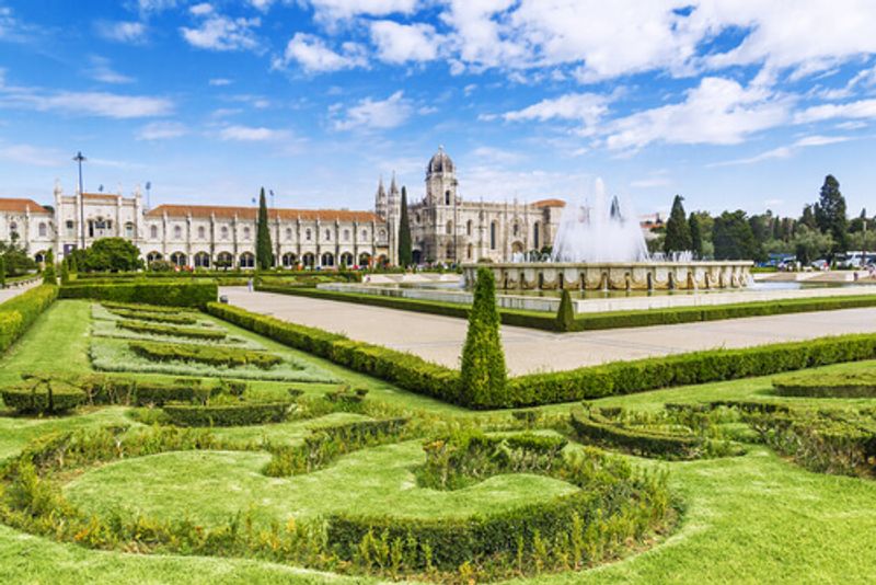 The elaborate buildings and gardens of the Jeronimos Monastery.