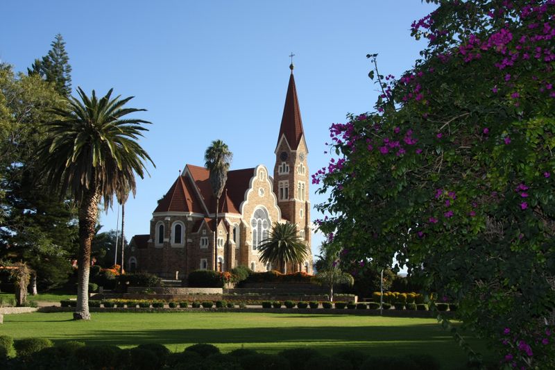 Windhoek’s Christuskirche viewed from the Tintenpalast gardens, a key landmark in Namibia’s capital city.