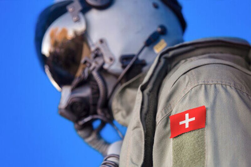 An Air Force pilot in uniform with a Switzerland flag patch in Switzerland.