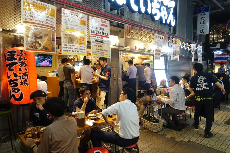 Japanese Izakaya restaurant with salarymen dining at night in Ueno Tokyo