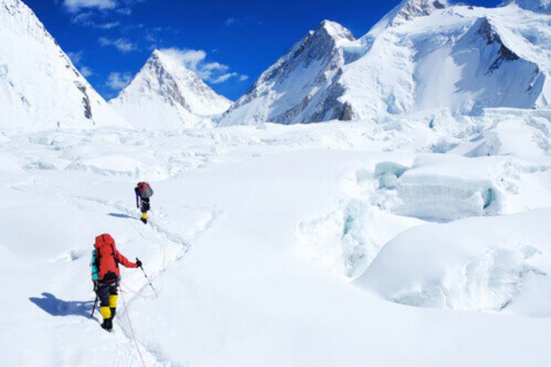 Climber reaching the summit of Everest in Nepal