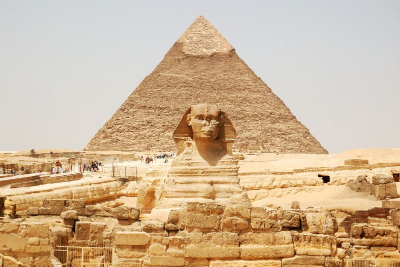 Sphinx and the great pyramids of Giza on a hot morning