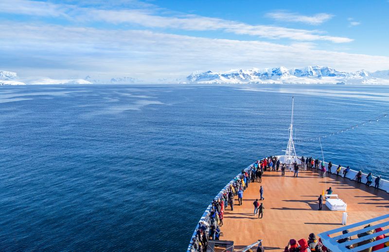 A cruise ship makes its way through Antarctic waters.
