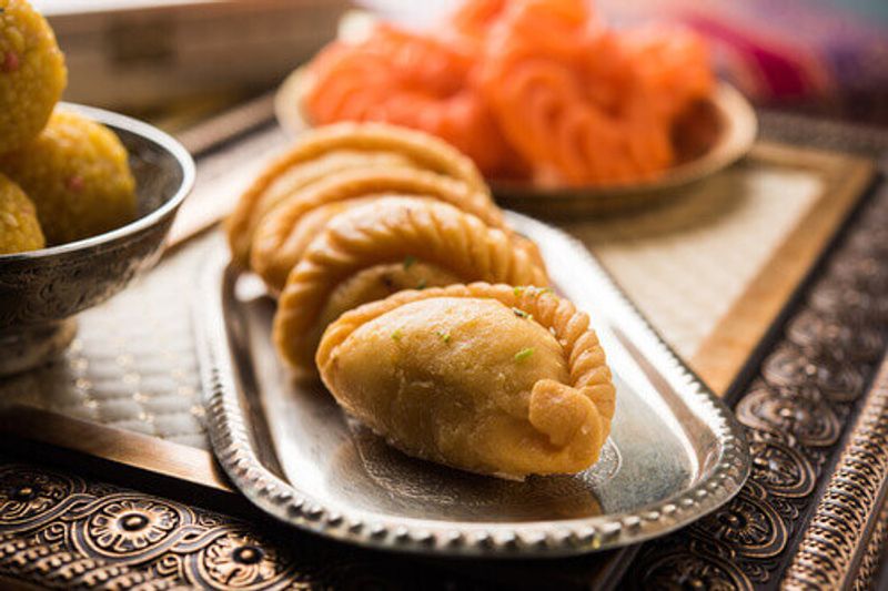 Gujiya, a crescent shaped bread made to celebrate the Holi festival in India.