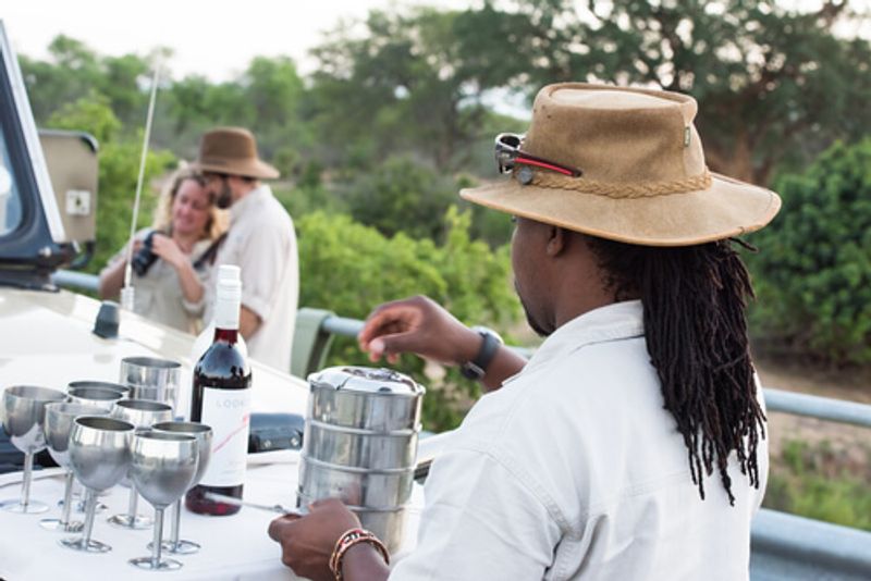 When on safari in Africa, tour guides supply visitors with amenities such as drinks and snacks.