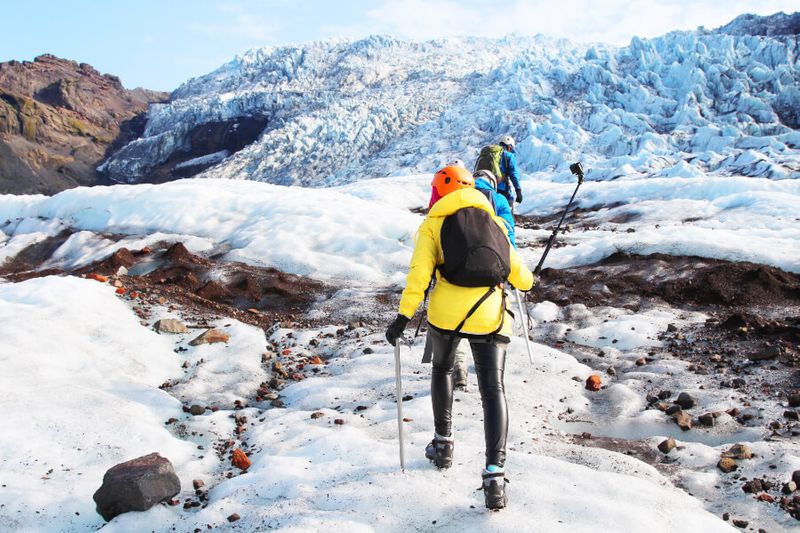 Tourists take part of the Solheimajokull Glacier Walk.