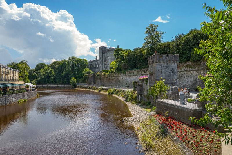 View of the Kilkenny Castle from the John Bridge on the Nore River.