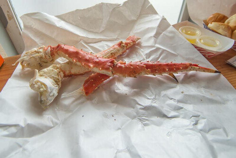 Delicious Alaskan crab legs on a table at Tracys King Crab Shack in Juneau.