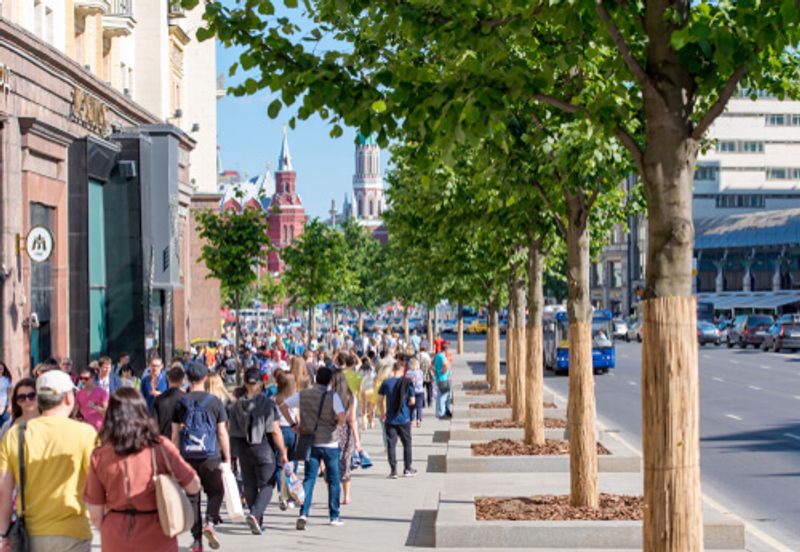 A bustling crowd moves through Tverskaya Street, Moscow, Russia.