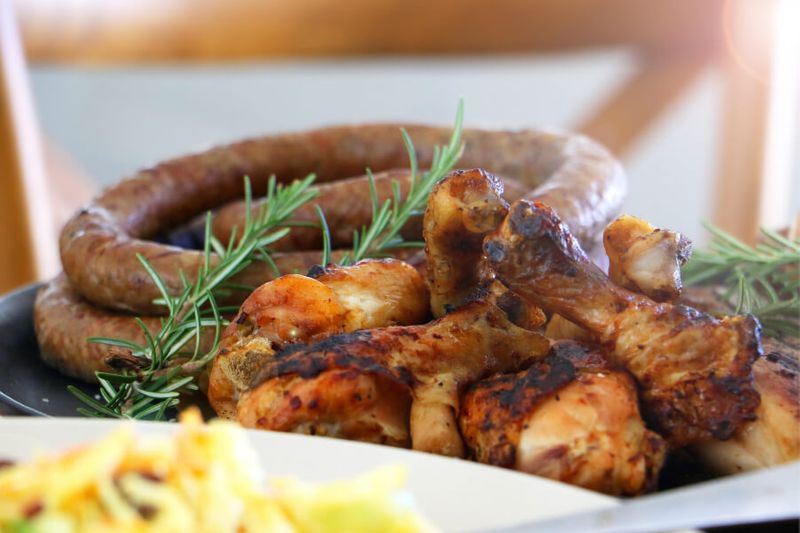 Close up of Peri Peri Chicken and Boerewors on a plate.
