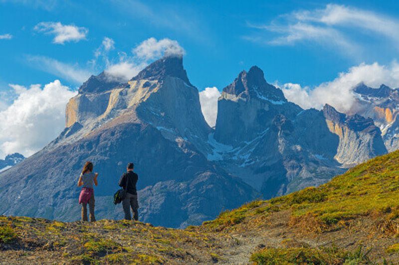 Tourists enjoying the view of the granite peaks in Torres del Paine National Park near Puerto Natales.
