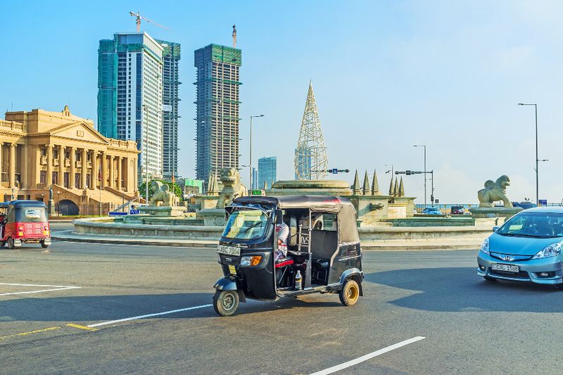 The roundabout in Galle Main Road with a tuktuk.