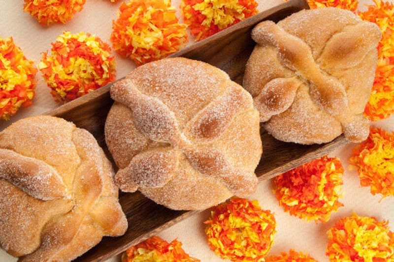 Sweet bread called Bread of the Dead or, Pan de Muerto, enjoyed during Day of the Dead festivities.