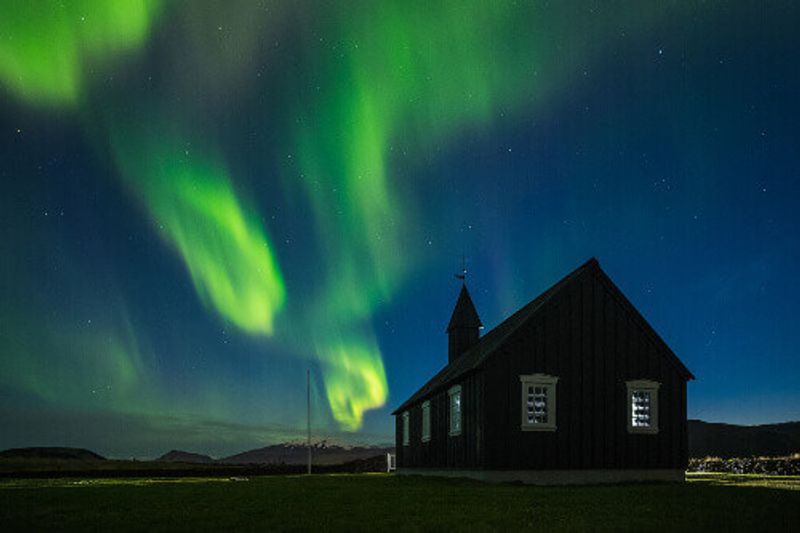 The Budakirkja, or the black church with beautiful northern lights.