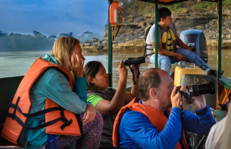 People on boat in the Amazon Rainforest.