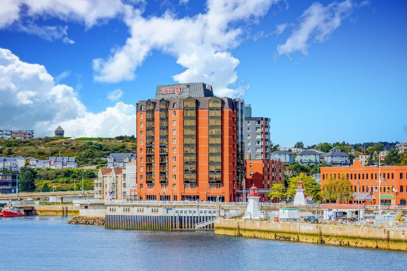 The Hilton Hotel near the port in Saint John New Brunswick with the waters from the Bay of Fundy in view.