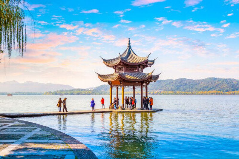 Visiting a pagoda at the beautiful West Lake.