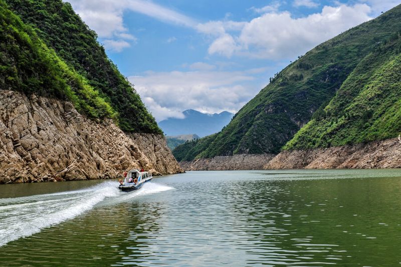 A boat passing through the Lesser Three Gorges.