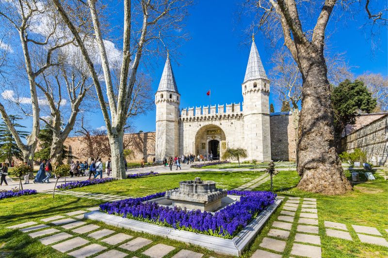 Tourists visit the Gate of Salutation at Topkapi Palace, Istanbul.