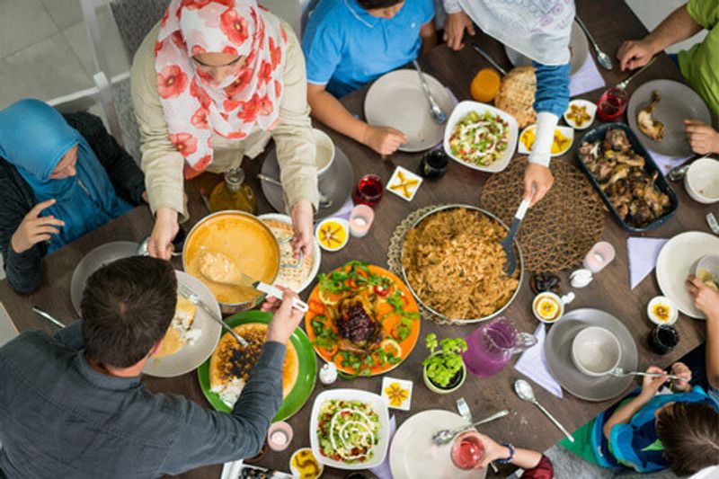 A family gathers to break their fast, or Iftar during Ramadan.