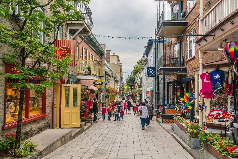 Tourists enjoy the quaint Old Montreal Street, which boasts shops and restaurants.