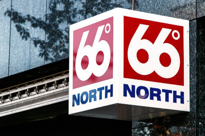 66 Degrees North sign, attached to the wall above the entrance to the retail clothing store.