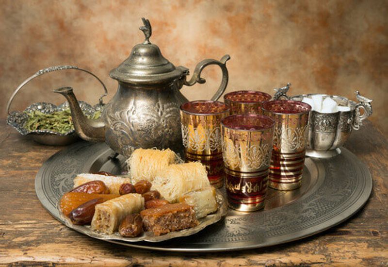 Oriental tea tray with dates and cookies symbolising Moroccan hospitality.