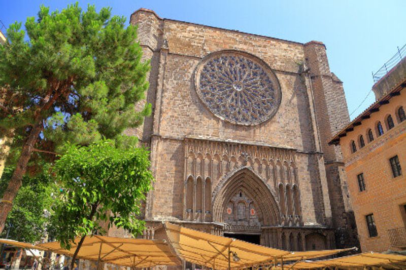 A large window on the main facade of Santa Maria del Pi Church.