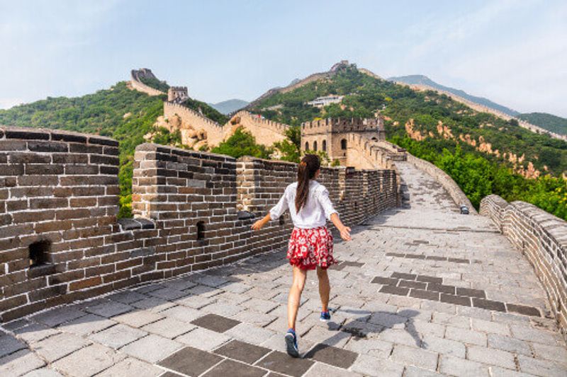 Tourist having fun at the Great Wall of China