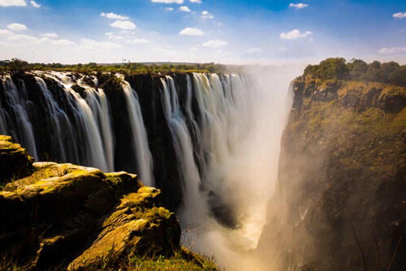 The Victoria Falls are a picturesque wonder that visitors flock to see.