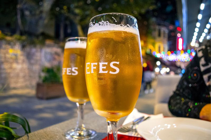 Tourists drinking Efes Beer in the Sultanahmet district of Istanbul