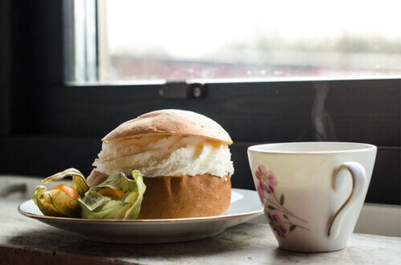 Semla is a traditional small wheat flour bun, served with a coffee.