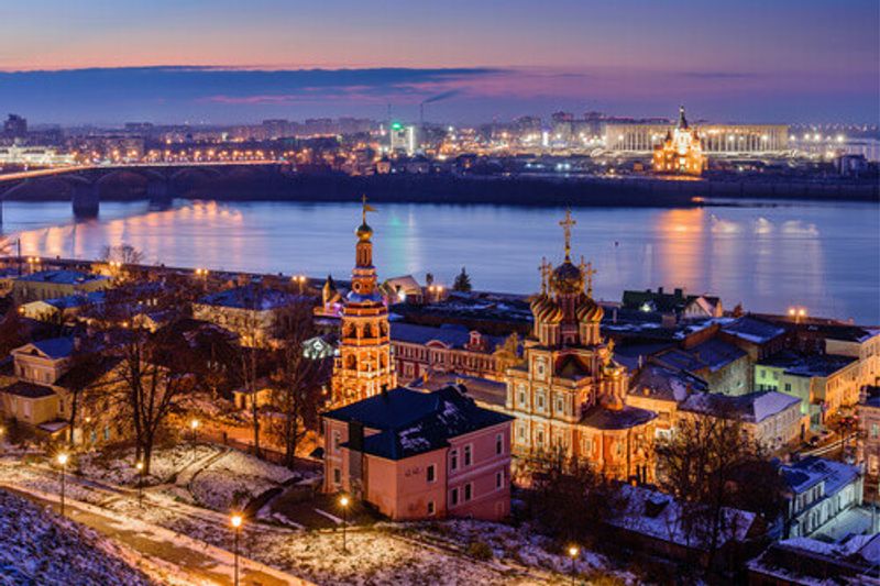 Beautiful panoramic view of the city in the evening near Kremlin with the Stroganov Church and Oka River in view.