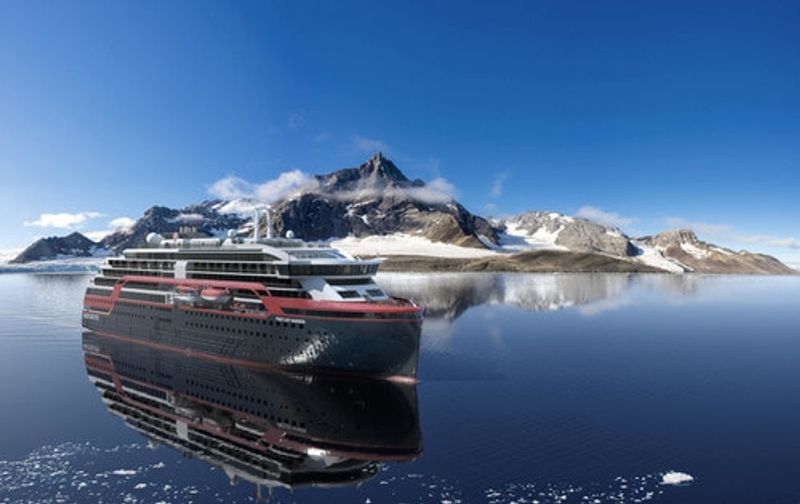 A ship gliding through Antarctic seas.