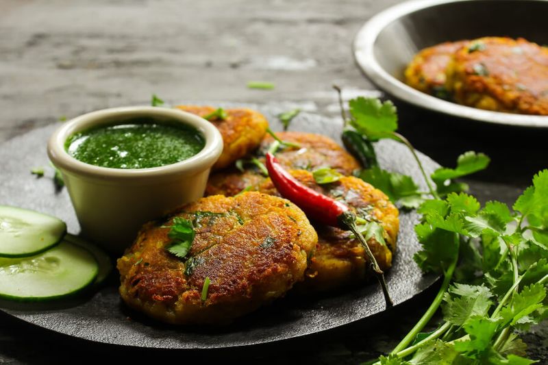 Aloo Tikki or Indian Potato Patties served with cilantro chutney