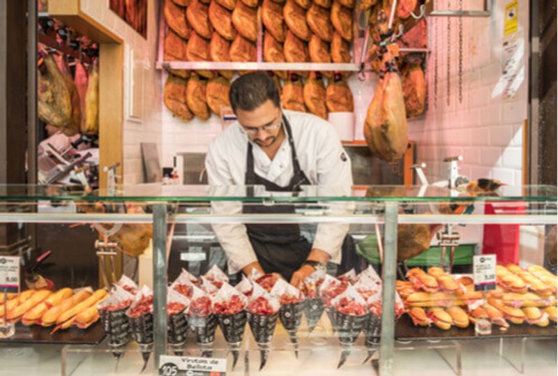 Delicious food is available for purchase in a Madrid Market Stall, Spain.