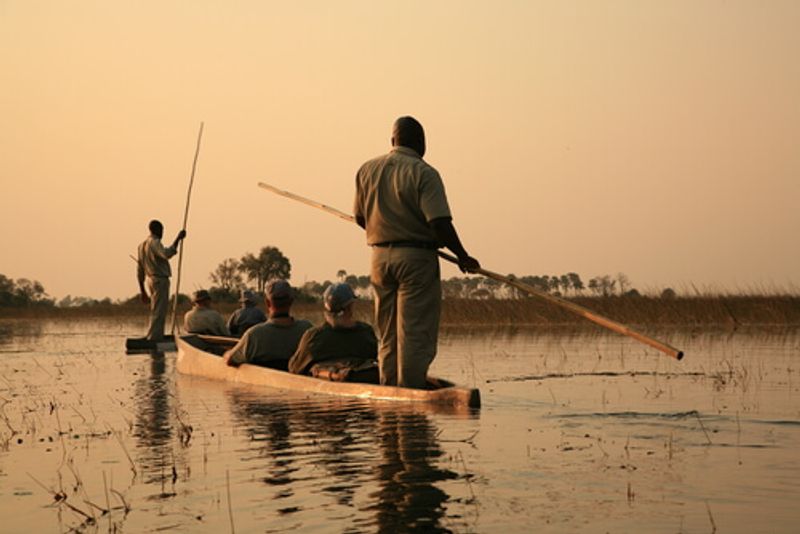 In Botswana, visitors and locals can see the natural sights via canoe.