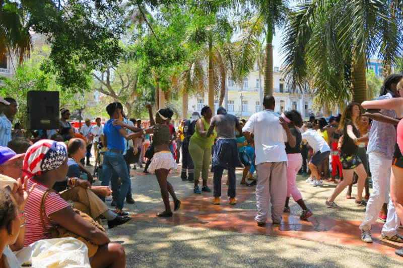 People dance salsa in one of the central squares in Havana.