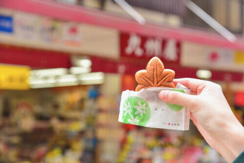 Visitors can enjoy a Green Tea Momiji Manju or Japanese-Style Sweet Cake Filled with green tea paste in Miyajima.