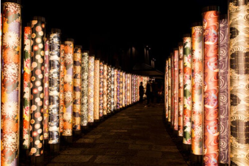 Artwork in the Arashiyama Kimono Forest at night in Kyoto,  Japan.