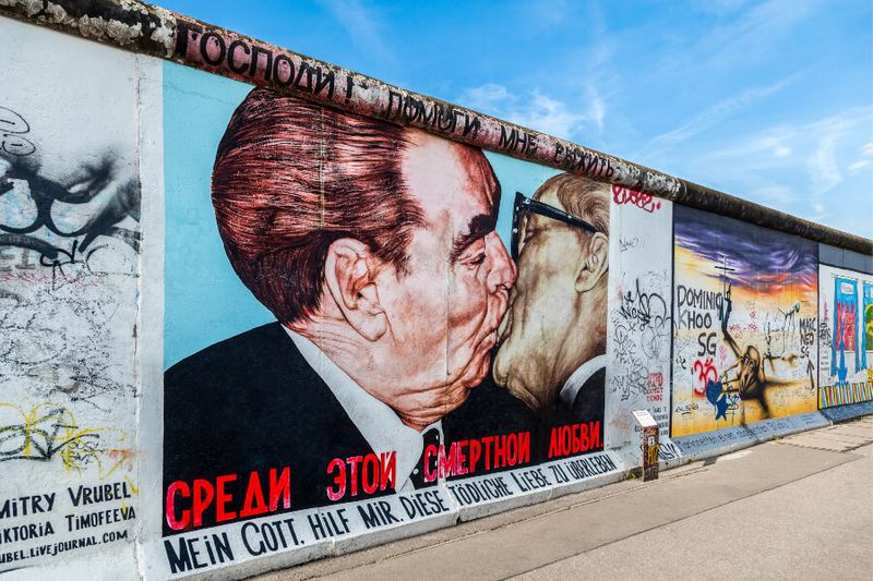 Controversial graffiti on the east side gallery of the Berlin Wall.