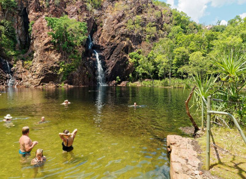 Visitors enjoy the Wangi Falls swimming hole.