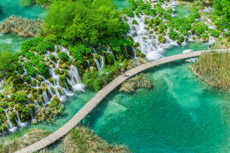 Tourist on the boardwalk in Plitvice National Park.