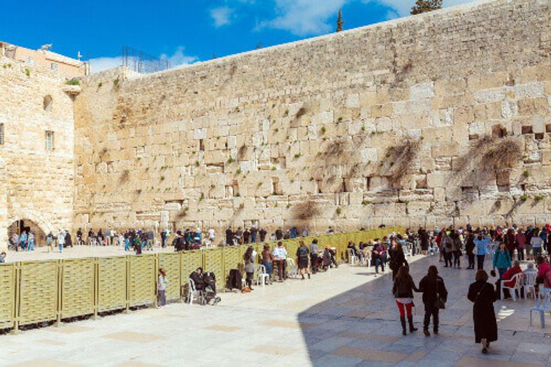 Men and women are praying separately at the Western Wall in Jerusalem, Israel.