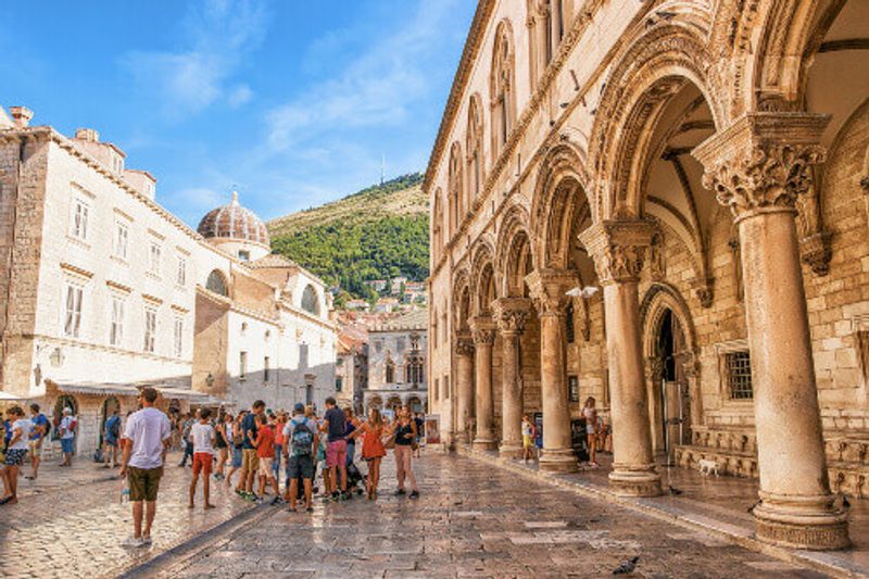 Tourists at the Rectors Palace on Stradun Street in the Old City of Dubrovnik.