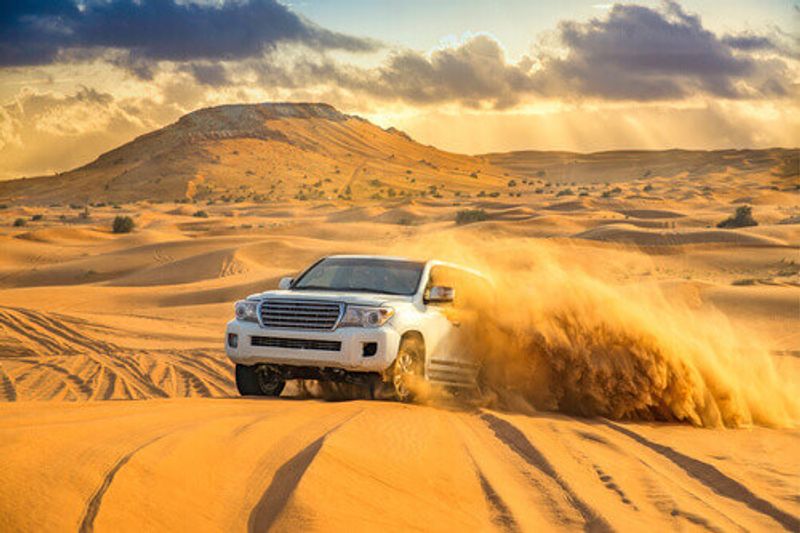 Offroad dune bashing during a desert safari in Dubai.